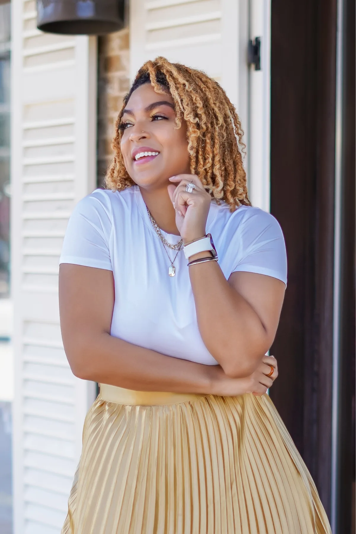 Fashion shoot, gold pleated skirt